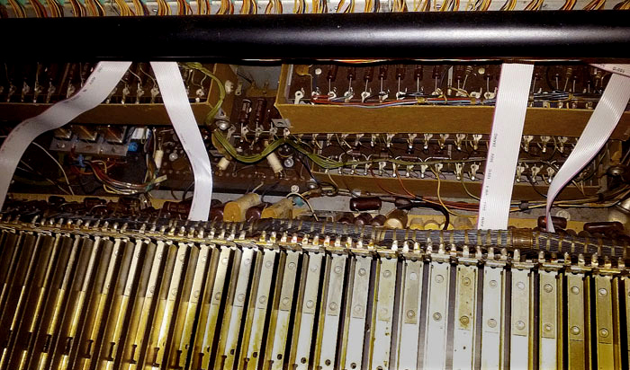 Ribbon cables for MIDI under the upper manual.
